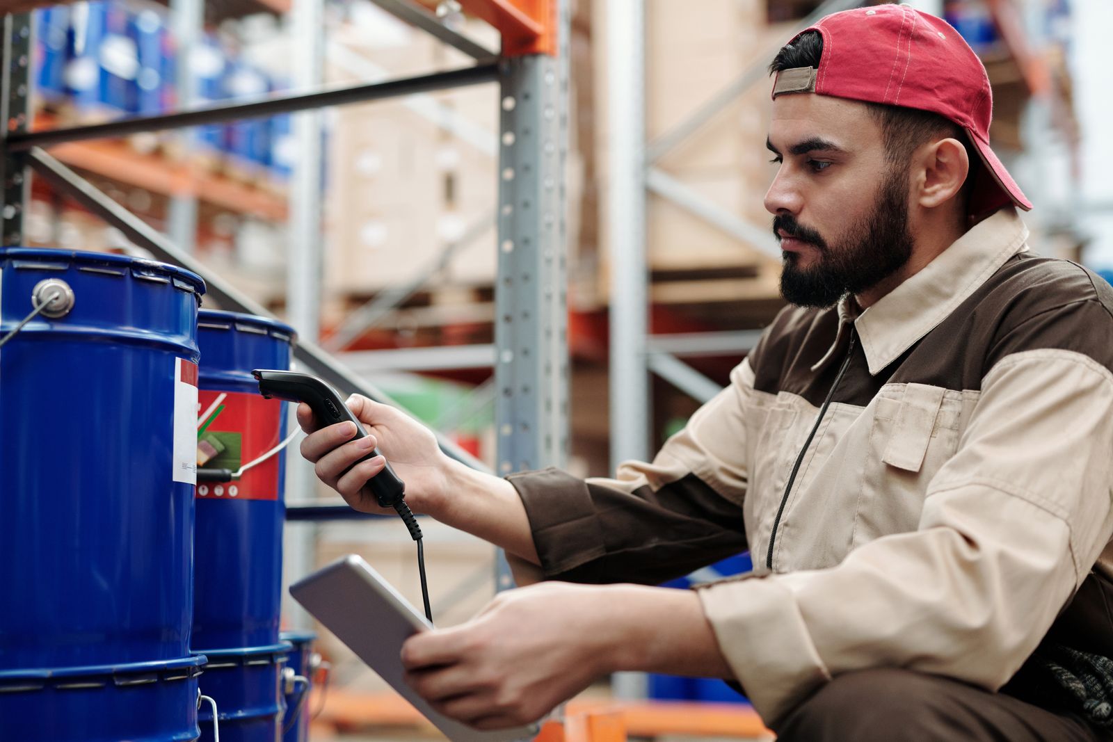 Operator scanning inventory with a handheld barcode scanner